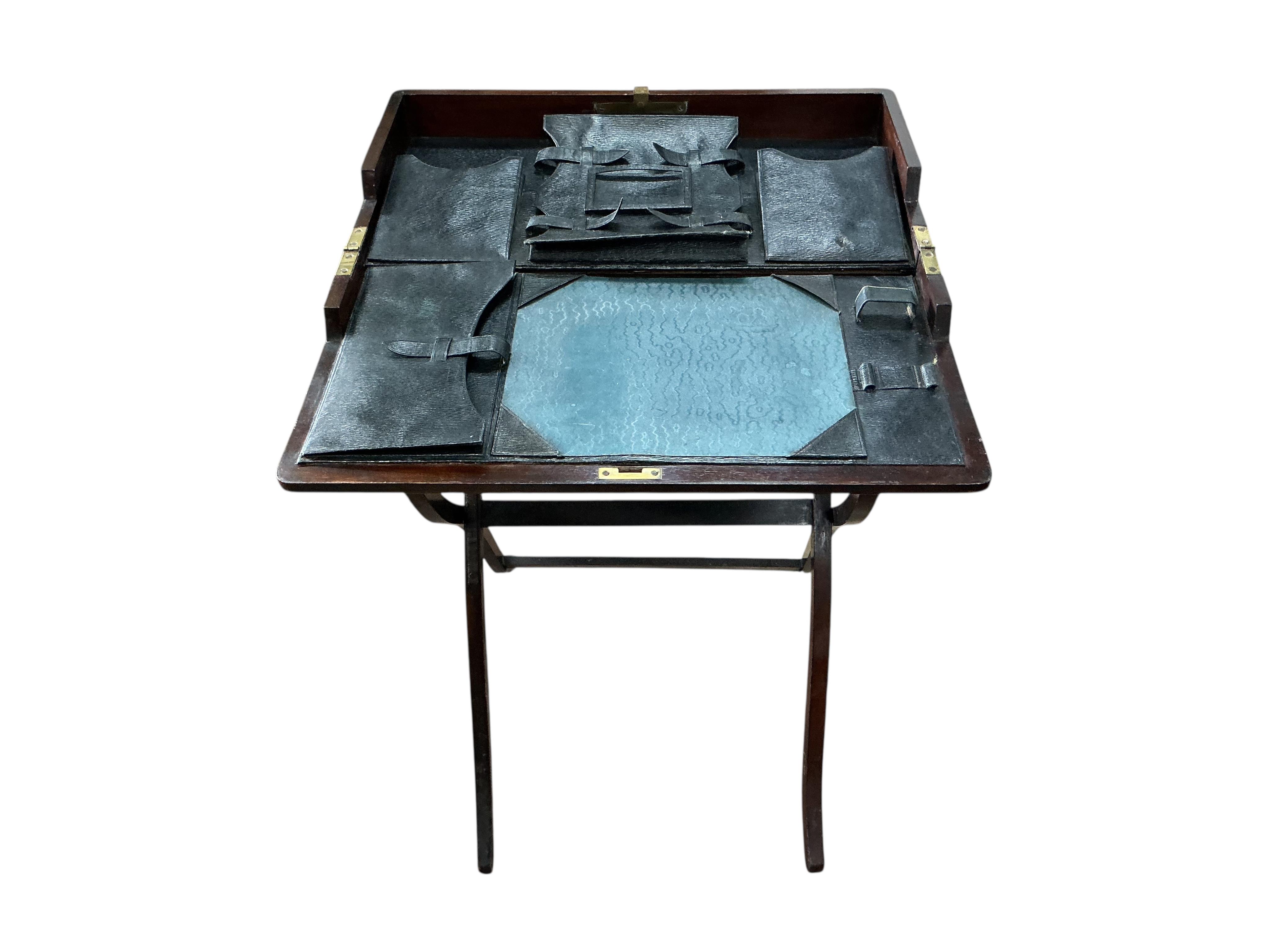 An early 20th century rectangular mahogany folding travelling writing table, width 56cm, height 92cm